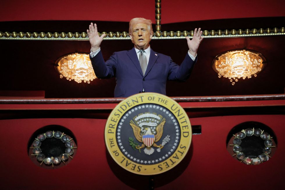 u200bPresident Donald Trump gestures while he poses for a picture at the presidential box at the Kennedy Center,