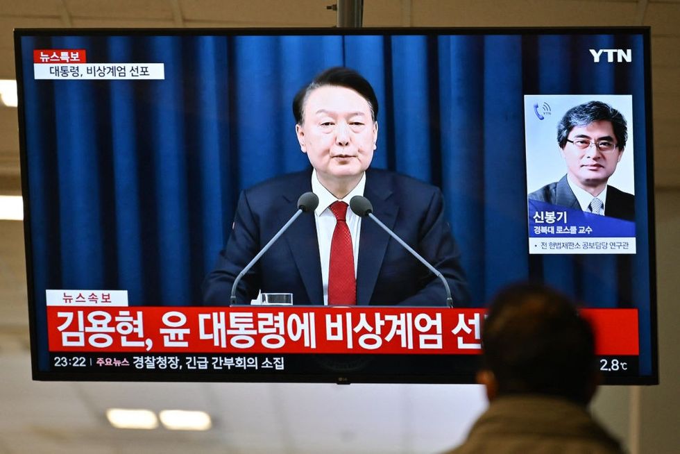 u200bPresident Yoon Suk Yeol speak during a news broadcast on a television at a train station in Seoul