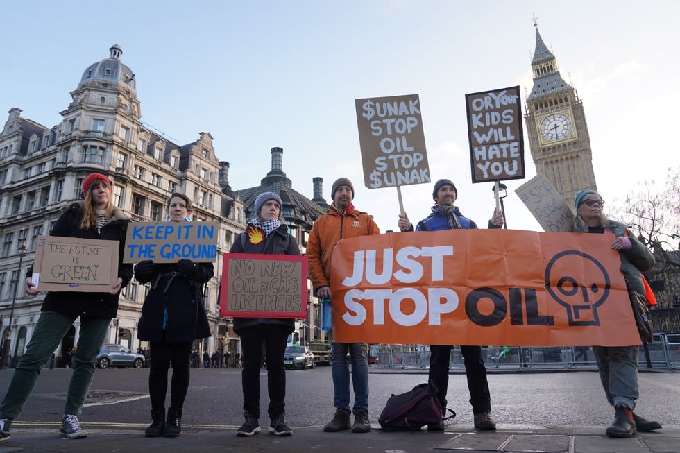 u200bProtesters from Just Stop Oil, Extinction Rebellion, Fossil Free London and Scientist Rebellion take part in an "emergency demonstration" at Parliament Square,