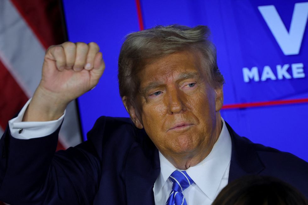 \u200bRepublican presidential nominee and former US President Donald Trump pumps a fist during a campaign stop in Milwaukee