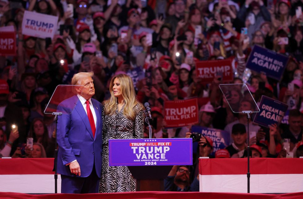 u200bRepublican presidential nominee Donald Trump embraces former First Lady Melania Trump