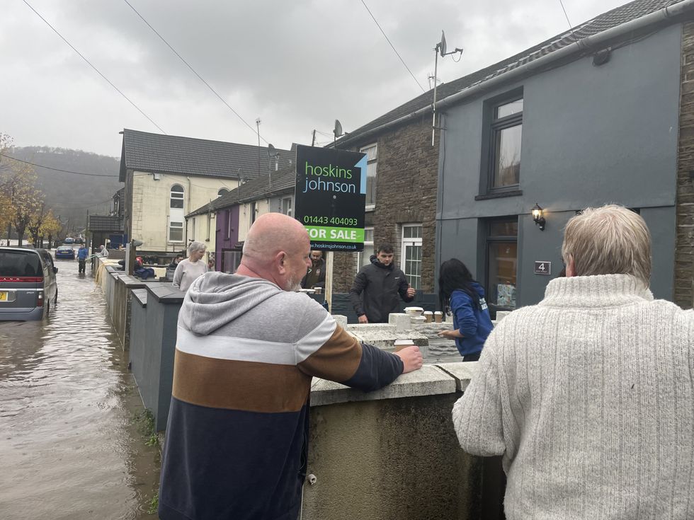 u200bResidents attend to their properties on Sion Street in Pontypridd