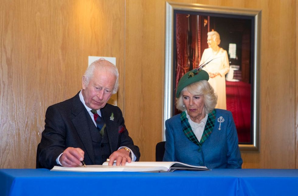 u200bScottish Parliament, King Charles III and Queen Camilla sign the Visitorsu2019 Book at the Scottish Parliament