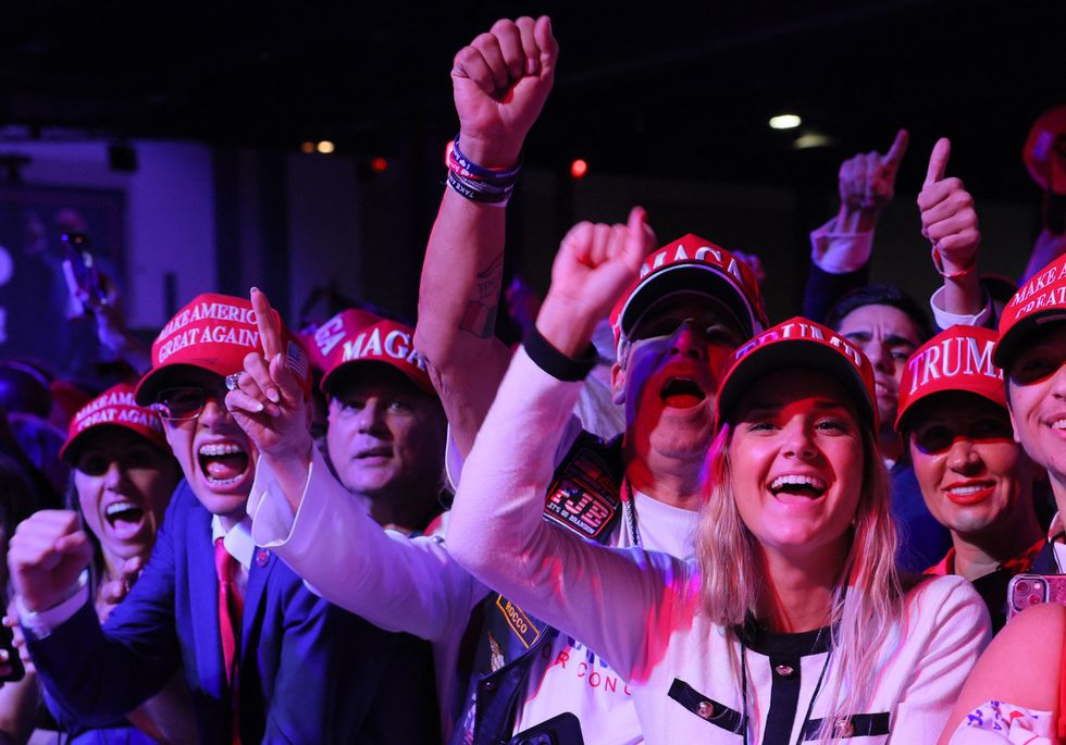 u200bSupporters of Donald Trump react at the site of his rally, at the Palm Beach County Convention Center in West Palm Beach