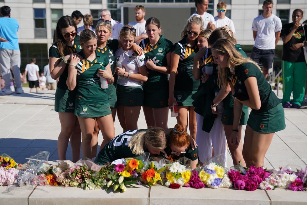 u200bTeam mates of victim Grace O'Malley Kumar lay flowers in her memory during a vigil at the University of Nottingham