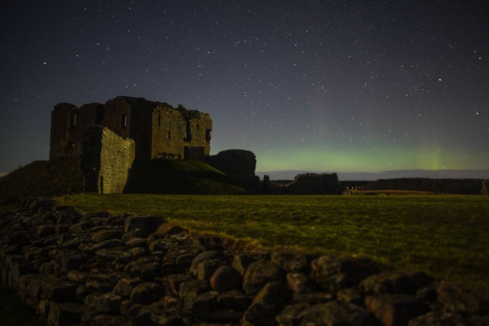 u200bThe Aurora Borealis is seen above the ruins of Duffus Castle on February 20, 2021 in Duffus, Scotland.