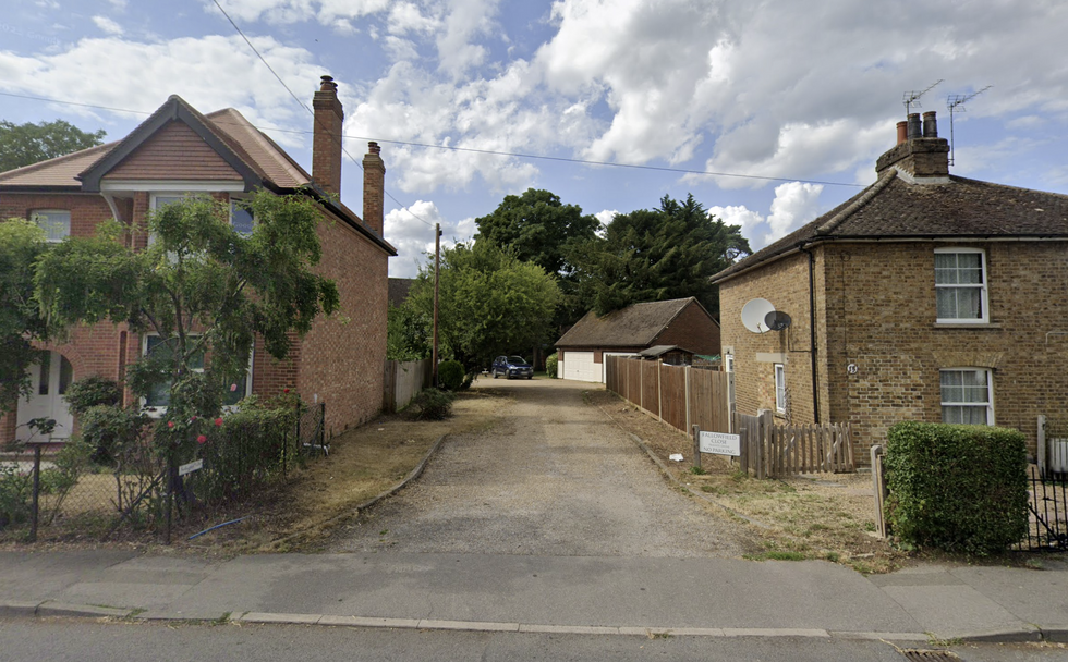 \u200bThe entrance to the driveway shared by the pair