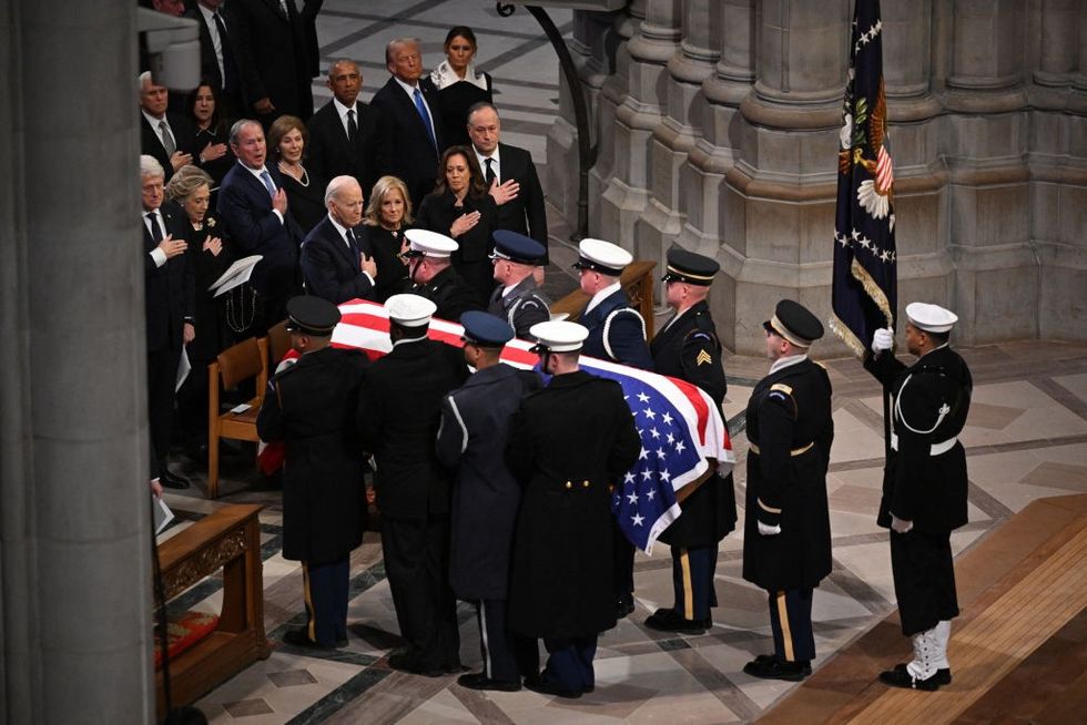 \u200bThe remains of former US President Jimmy Carter are carried out of Washington