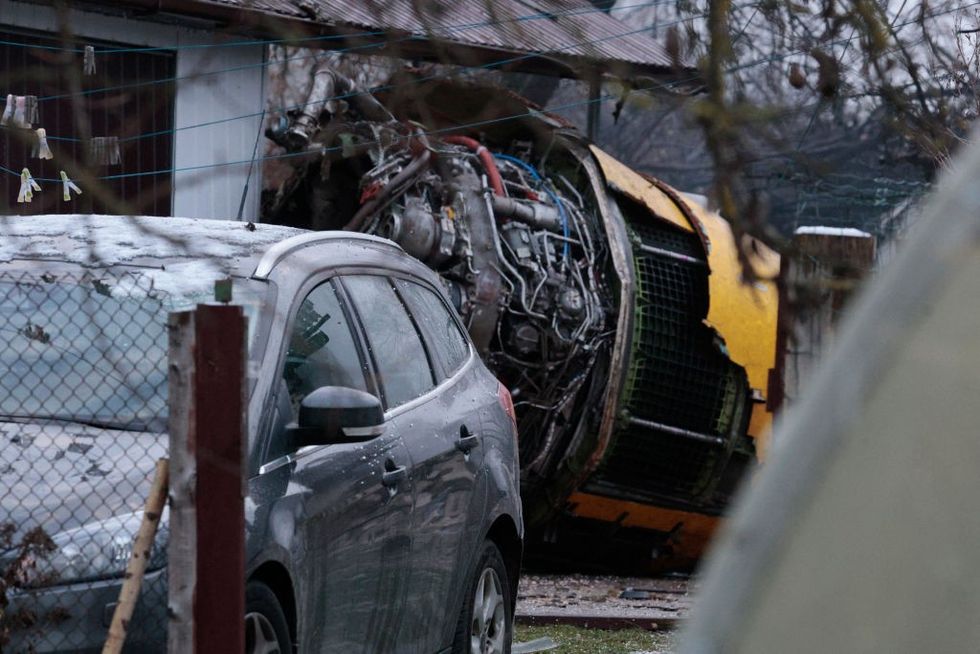 u200bThe wreckage of a cargo plane in the courtyard of a house following its crash near the Vilnius International Airport in Vilnius.