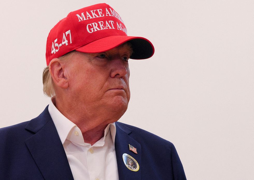 u200bTrump wears an "I Voted" sticker as he speaks to reporters after voting at Mandel Recreation Center on Election Day in Palm Beach, Florida,