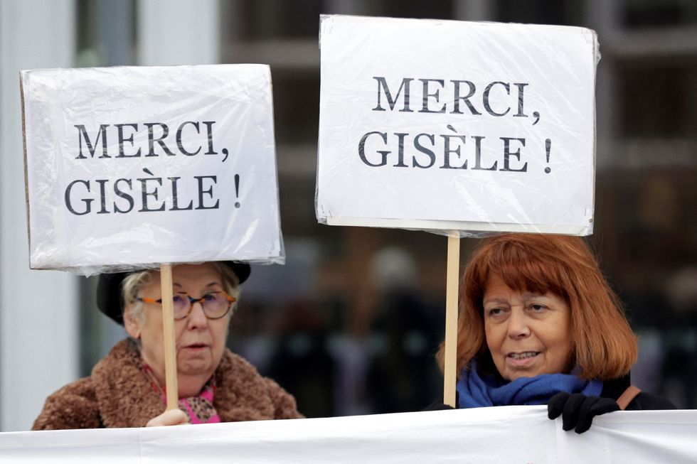 u200bTwo women hold placards in support of Gisele Pelicot