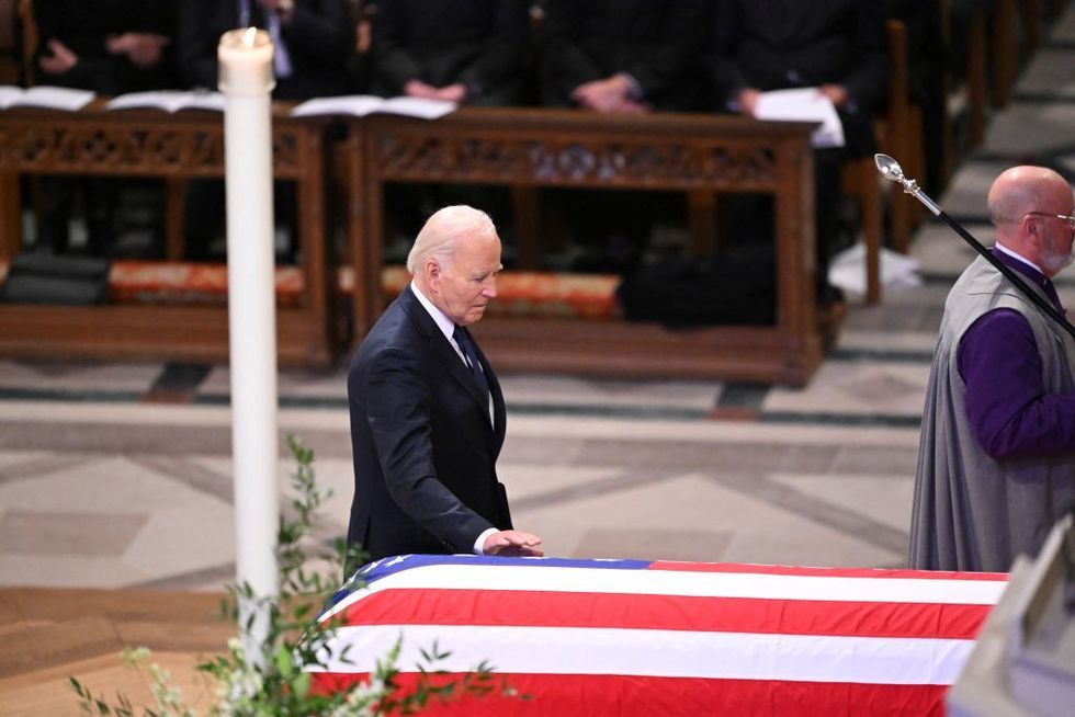 u200bUS President Joe Biden touches the casket of former US President Jimmy Carter