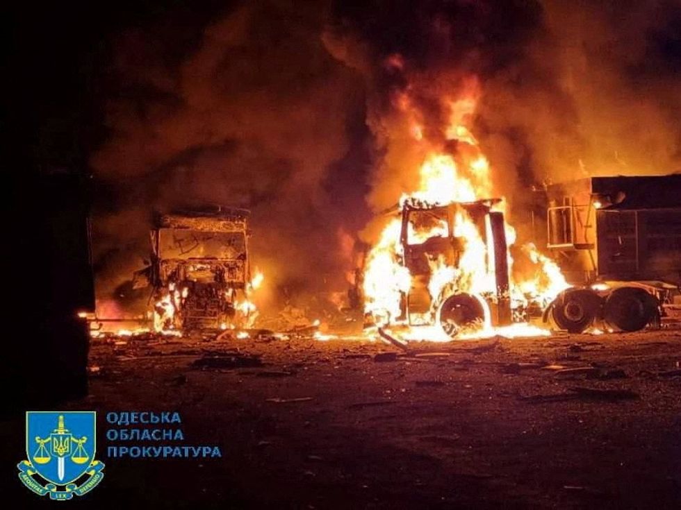 u200bVehicles on fire, amid Russia's attack on Ukraine, in the Odesa region of Ukraine