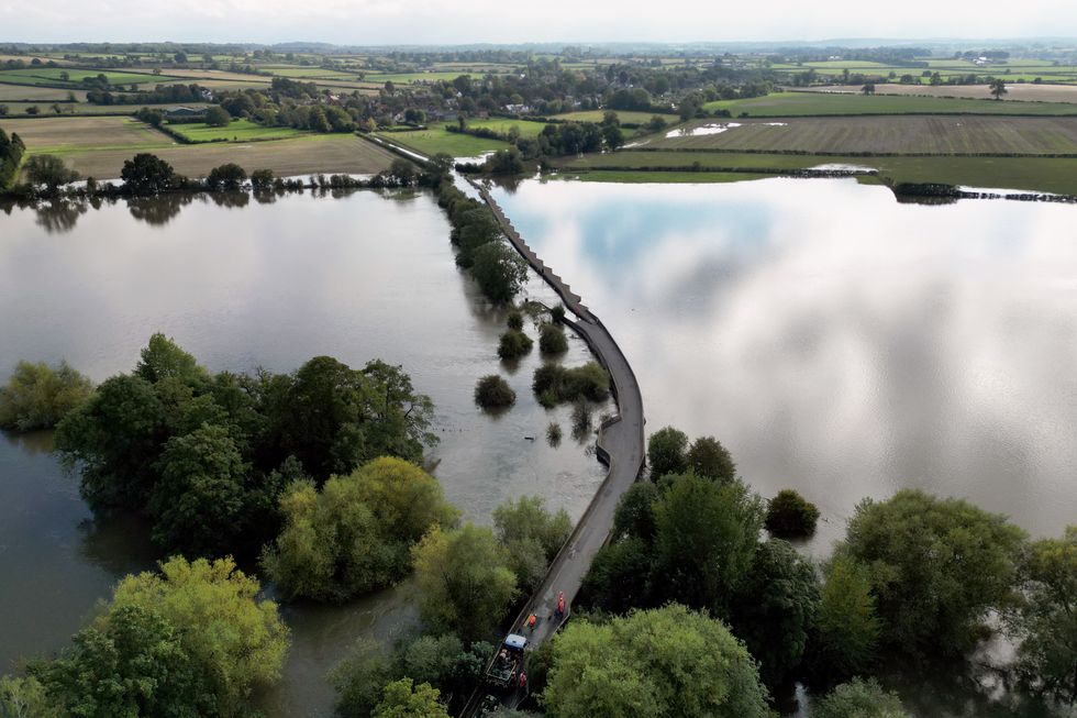 u200bWorkers close Carlton Road in Harrold, Bedfordshire