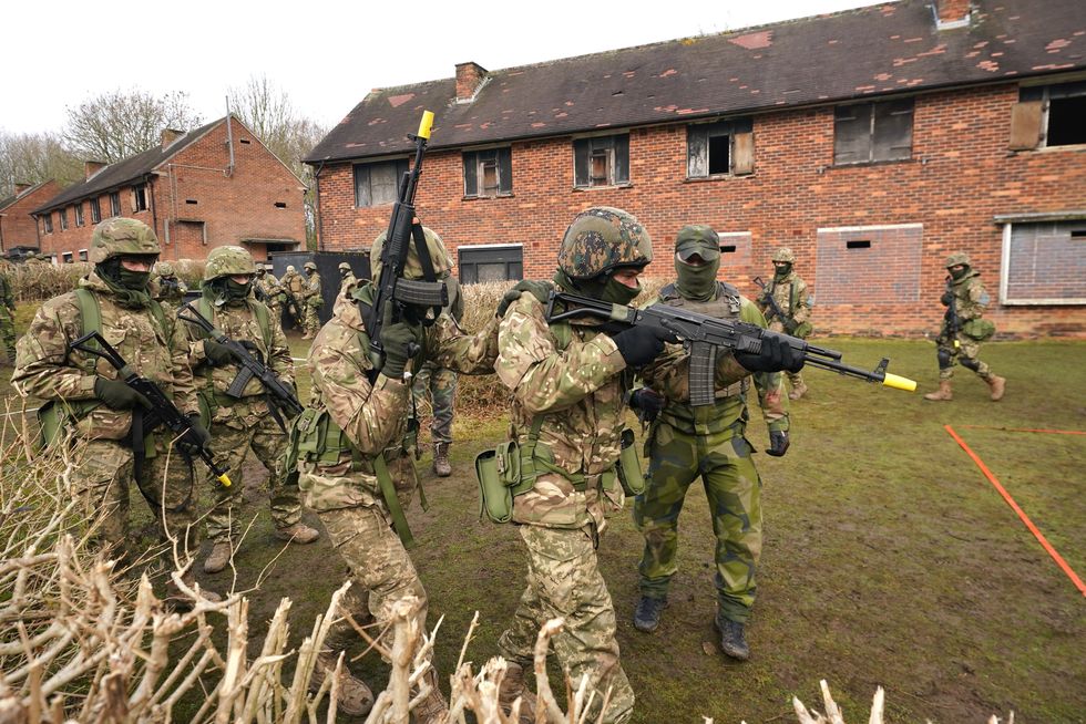 Ukrainian soldiers take part in urban training at a military training camp in Yorkshire