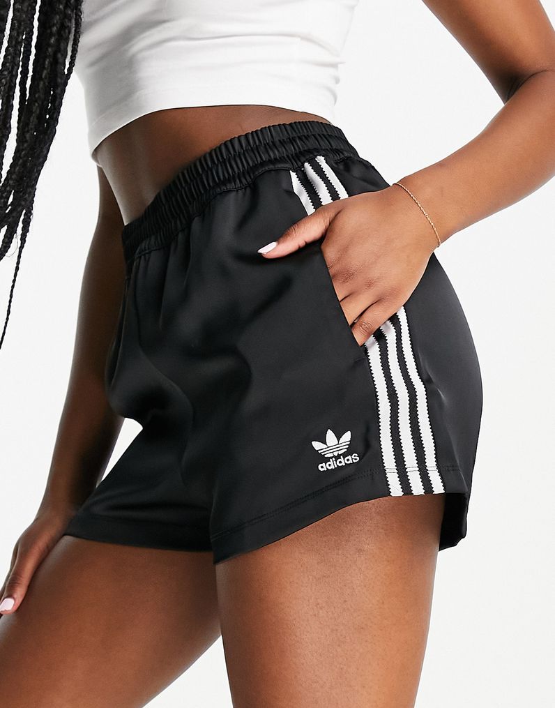 https://www.gbnews.com/media-library/undated-handout-photo-of-adidas-originals-adicolor-three-stripe-satin-look-shorts-in-black.jpg?id=32958942&width=796&quality=90