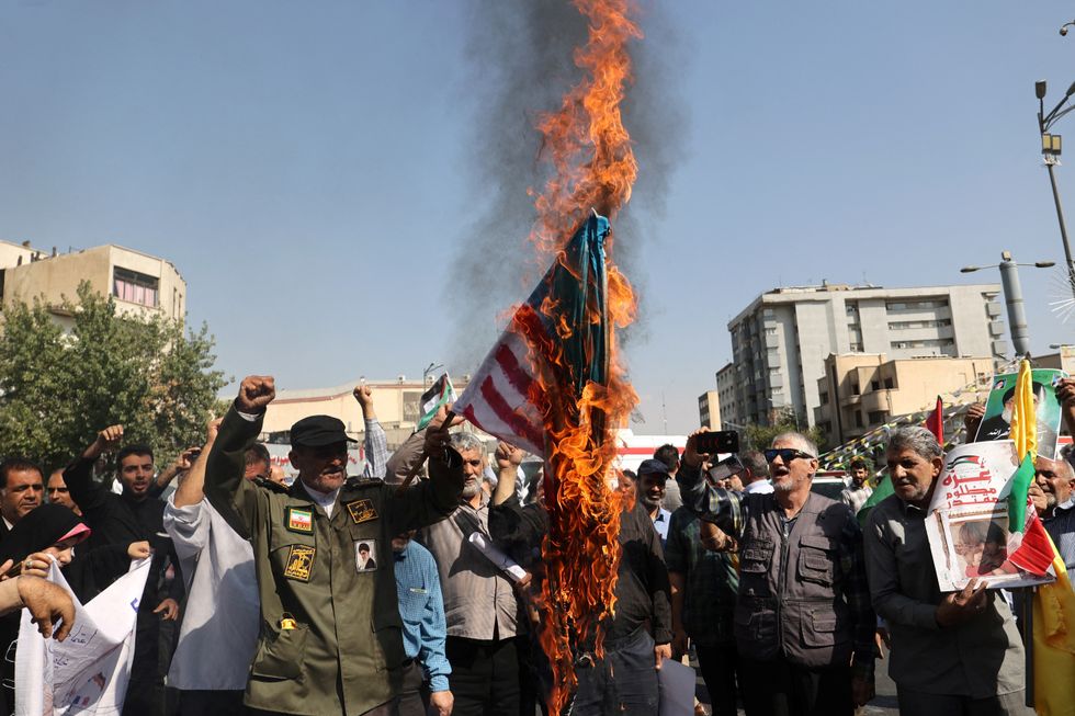 US flag burns in Tehran