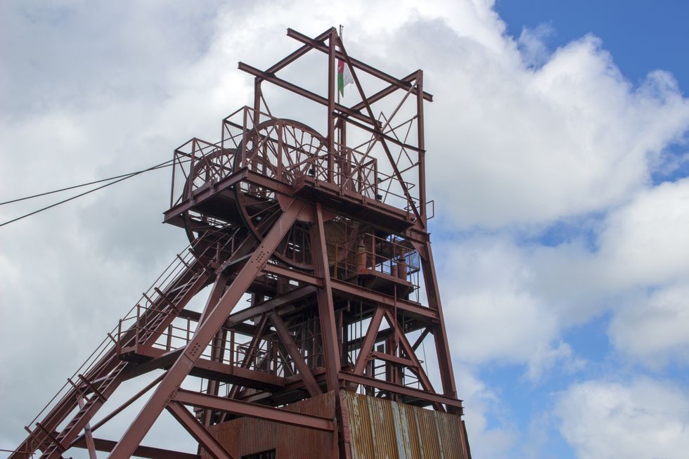 View of the winding tower powering the lift in the shaft leading down to the former Big Pit coal mine at the Big Pit National Coal Museum
