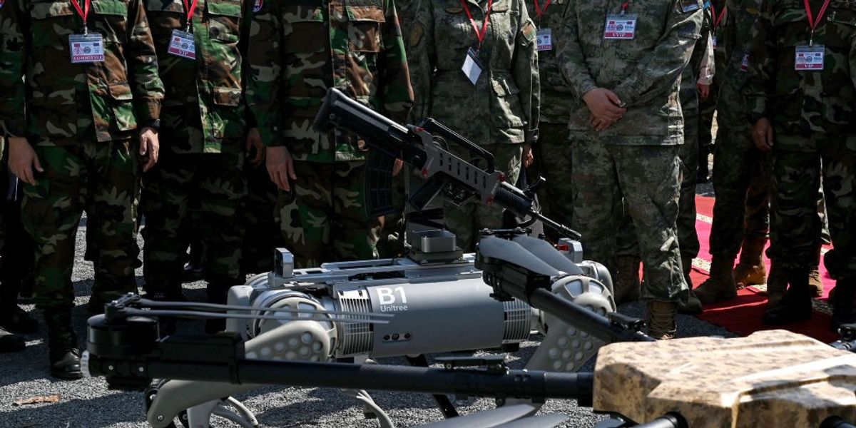 Xi Jinping unveils killer 'war dogs' with machine guns on their backs