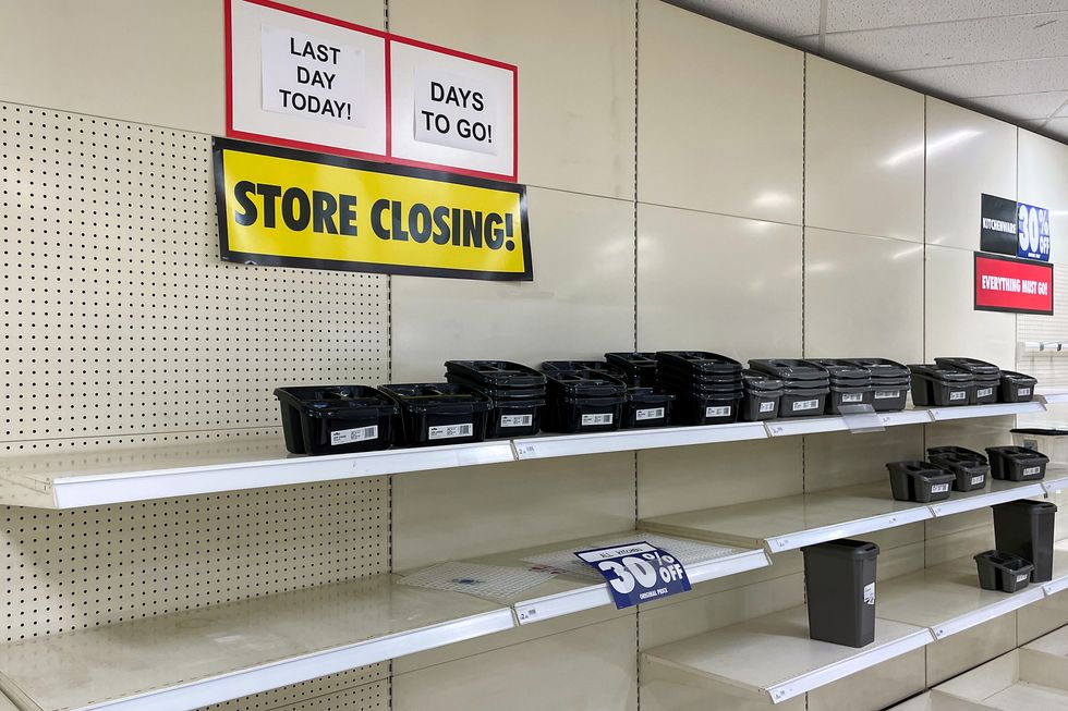 Wilko store shelves with store closing signs