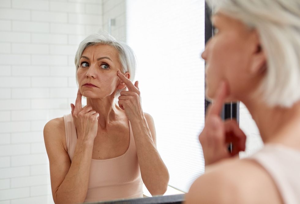 Woman applying skin care products