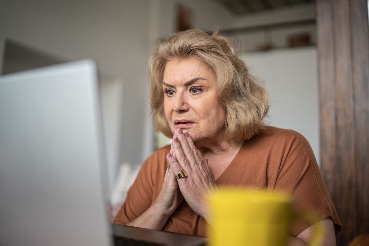 Woman confused at laptop