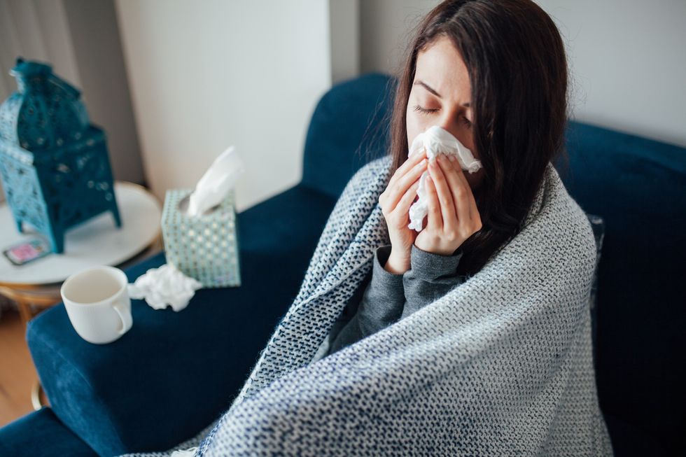 Woman feeling cold at home