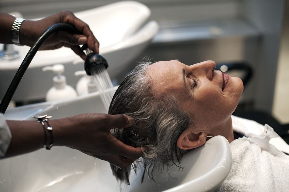 WOMAN GETTING HAIR WASHED