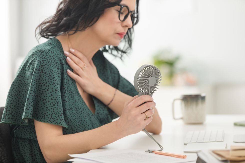 Woman holding a fan