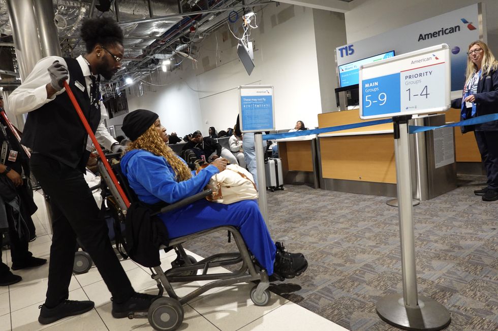 Woman in wheelchair at front of queue