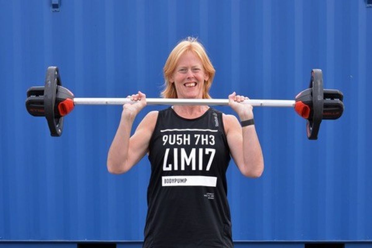 Woman lifting weights after weight loss