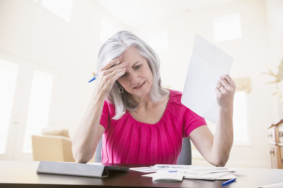 Woman looking annoyed at tax bill