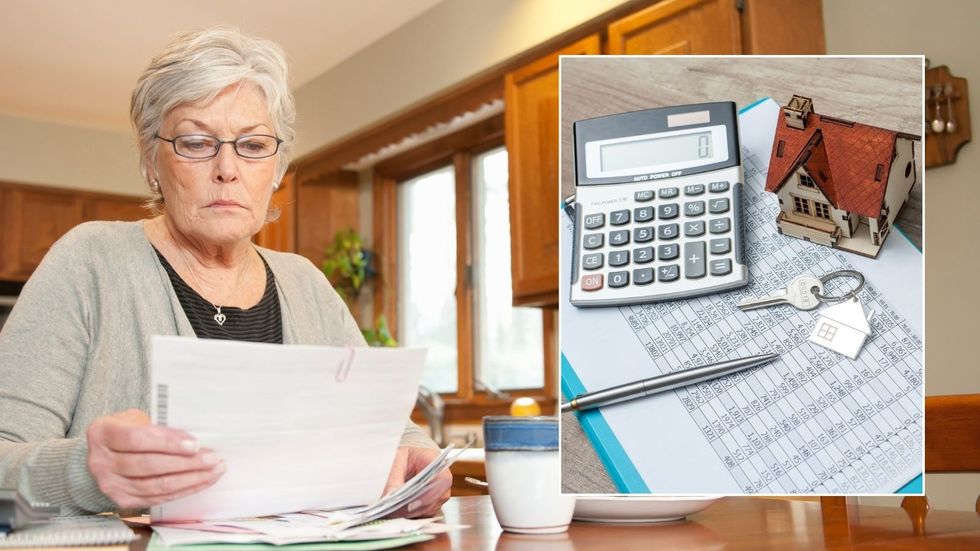 Woman looking at bill and mortgage bill 