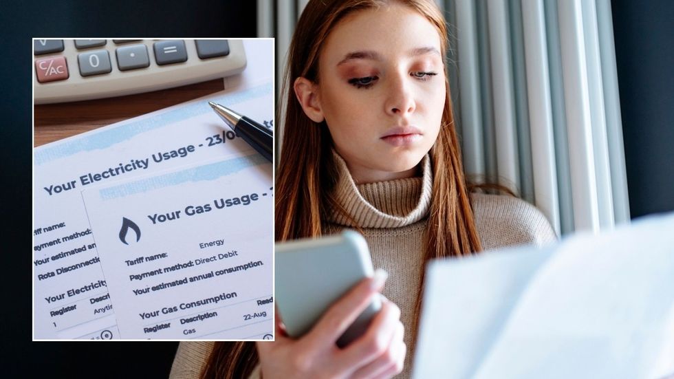 Woman looking at energy bill and energy bill