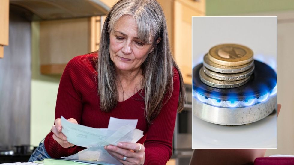 Woman looking at energy bill and pounds