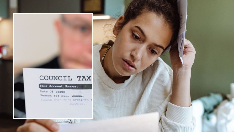 Woman looking at letter and council tax form 