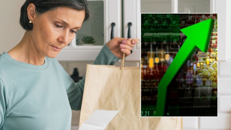 Woman looking at supermarket bill and inflation rise