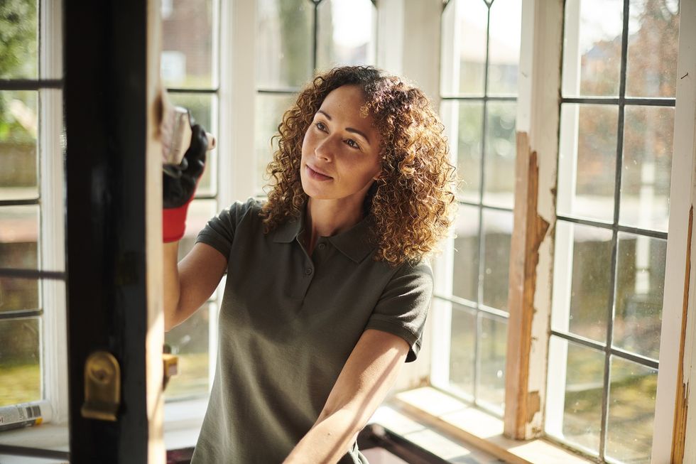 Woman painting door