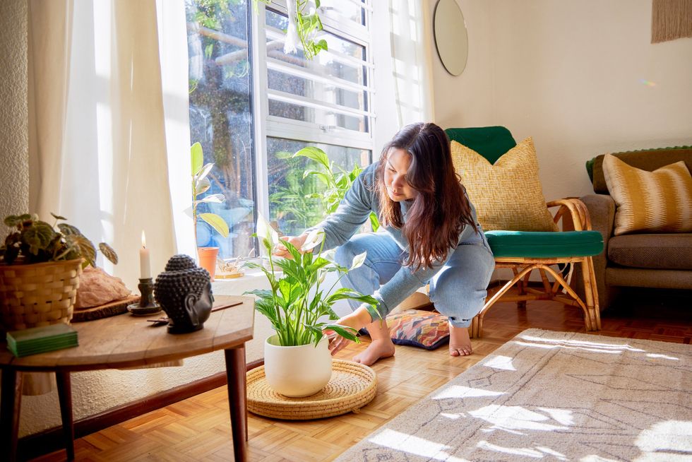 Woman rearranging furniture