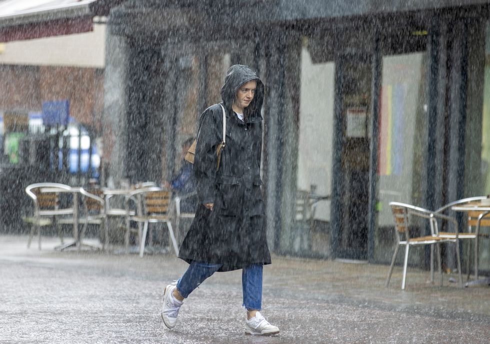 Woman walking in the rain