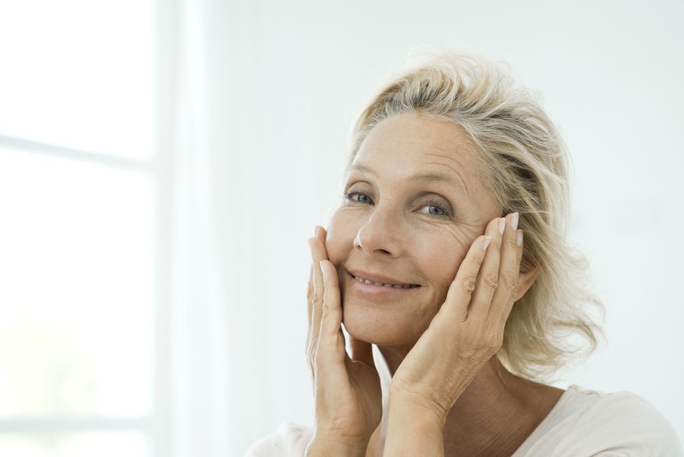 Woman with hands on her face