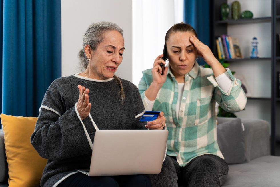 Women panicked at laptop