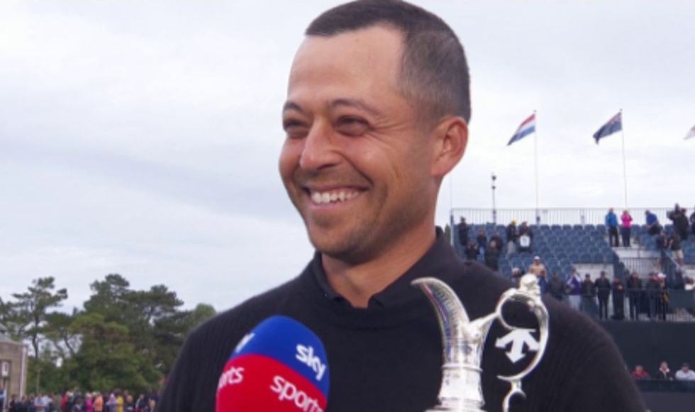 Xander Schauffele was all smiles as he held the Claret Jug