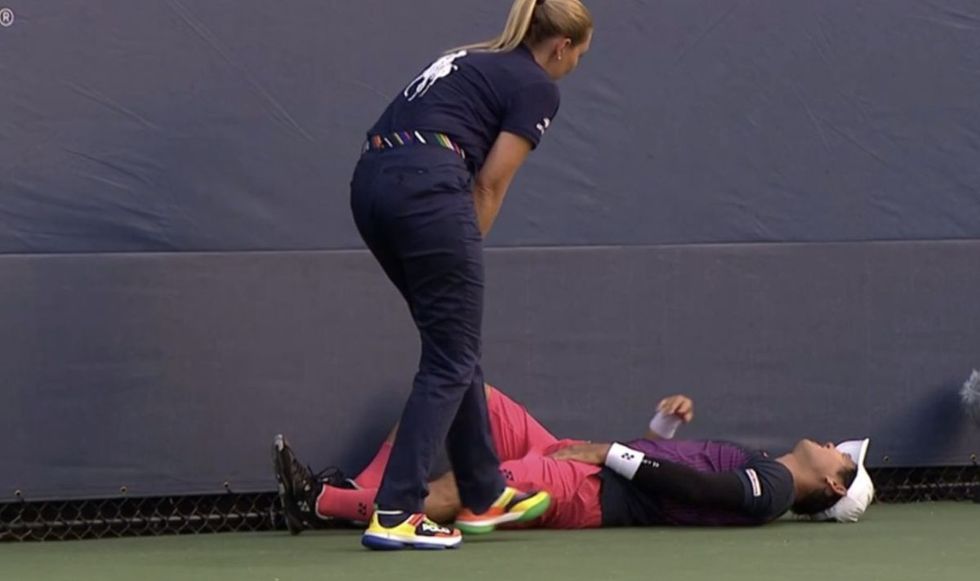 Yoshihito Nishioka fell to the ground in agony