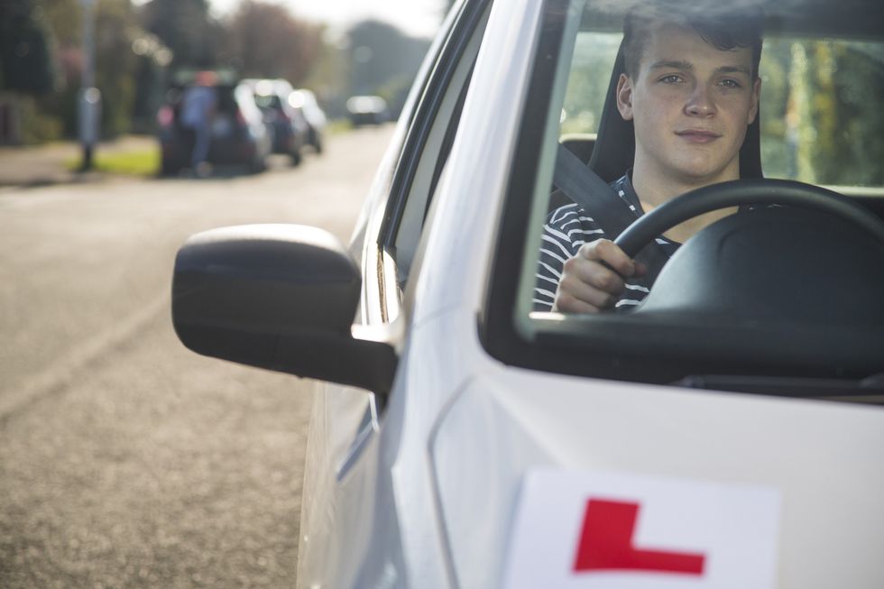 Young driver in car