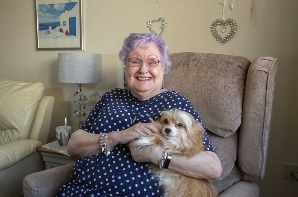 Yvonne Bailey at home with her dog